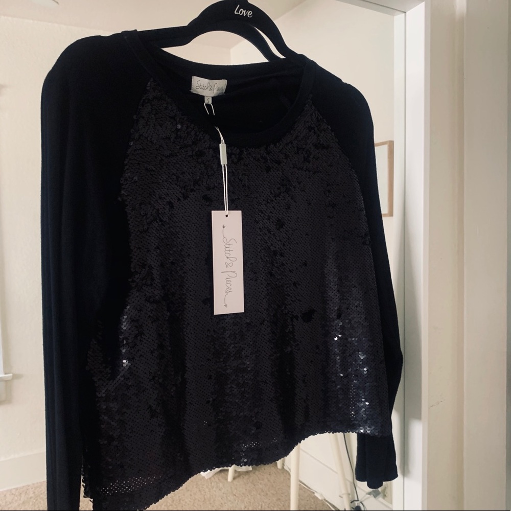 Black raglan sweater with sequins